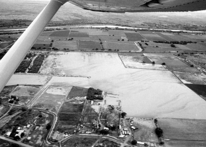 Ariel View of Floodwaters Ariel view of floodwaters seen with wing and strut of plane.